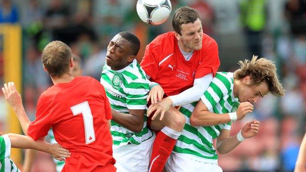 Cliftonville's Diarmuid O'Carroll gets above Celtic pair Darnell Fisher and Patrik Twardzik in last summer's friendly