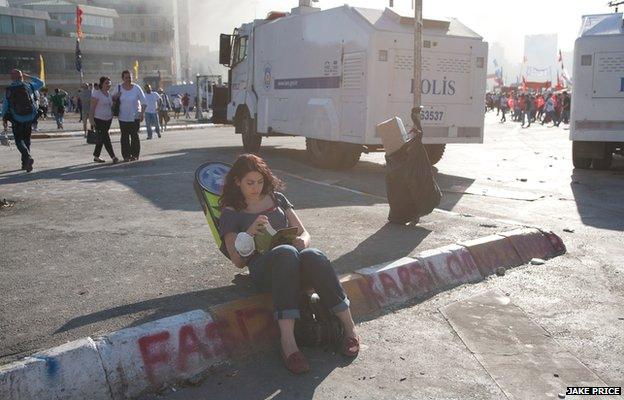 A protester reads a book