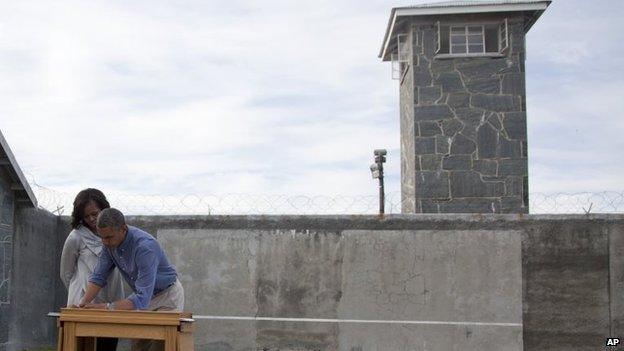 President Obama signs the visitors' book on Robben Island, 20 June 2013