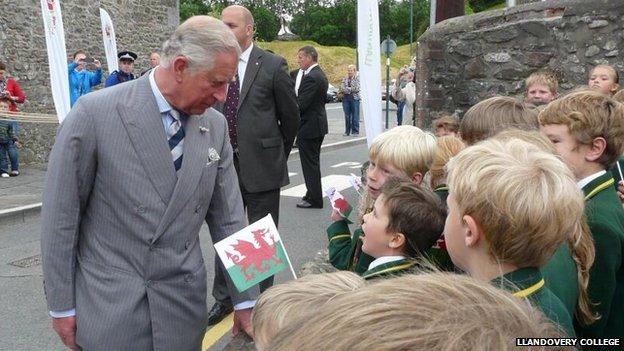 Prince Charles talks to children from Llandovery College prep school.