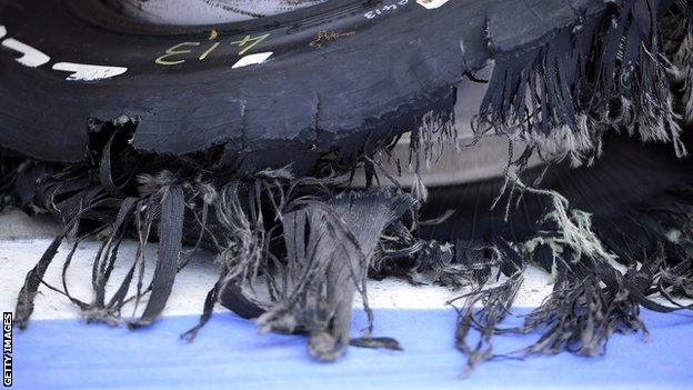 Ferrari driver Felipe Massa's shredded tyre in the pits at Silverstone