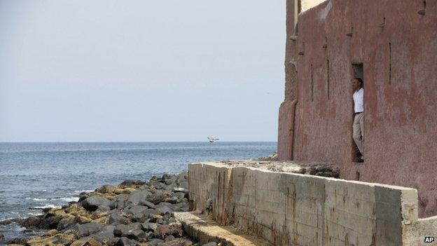 President Barack Obama looks out of the "door of no return" during a tour of Goree Island - Thursday 27 June 2013