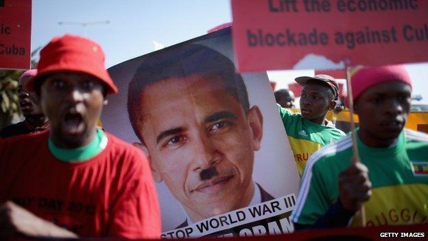 Protesters gather outside Johannesburg University in Soweto in advance of President Obama's meeting with students on 29 June 2013 in Johannesburg, South Africa