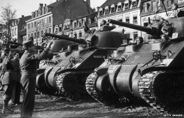 General Lattre de Tassigny, Commander in Chief of the French armies in France, inspecting the Allied Sherman tanks which liberated the French city of Colmar in 1945