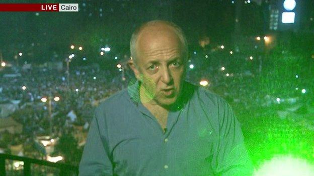 Jeremy Bowen picked out by laser pen in Tahrir Square