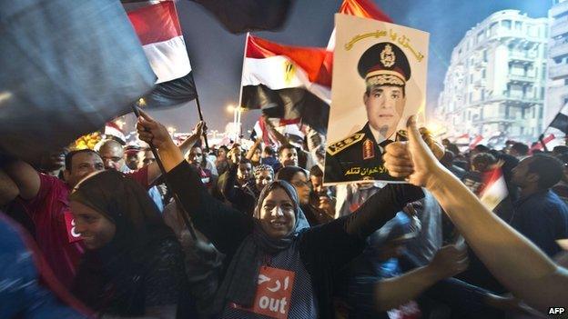 Crowds celebrating Mr Morsi's removal from power in Tahrir Square (4 July 2013)