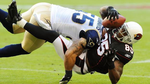 One NFL player forcefully tackles another