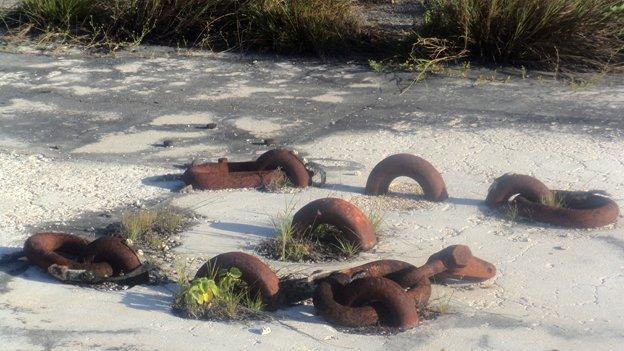 Rusted steel rings in concrete