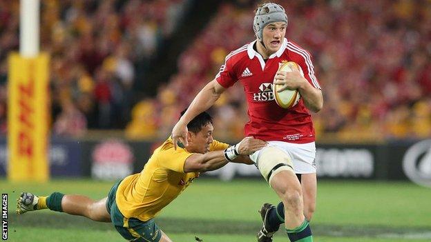 Jonathan Davies beats an Australian defender during the Lions' 41-16 win over the Wallabies in Sydney