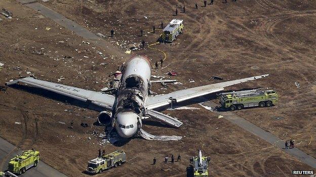 Search and rescue teams at the scene of the crash (7 July 2013)