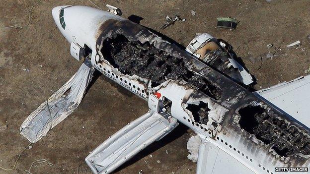 Plane wreckage on the runway (7 July 2013)