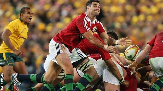 Mike Phillips passes from the base of a scrum for the Lions against Australia as Will Genia looks on