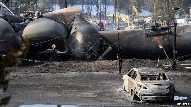 Destroyed oil containers are seen after the train derailment in Lac-Megantic, Canada, 7 July 2013