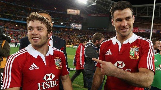 Leigh Halfpenny and Mike Phillips celebrate the 2013 Lions win