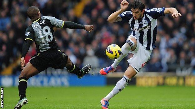 Goran Popov (right) in action against Tottenham Hotspur