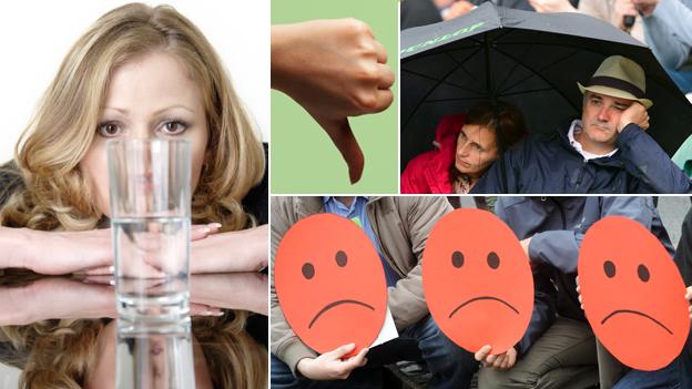 A composite including: a woman looking at a half fully or half empty glass; a thumb pointing down; two people under an umbrella looking glum; and three unhappy "smiley" faces