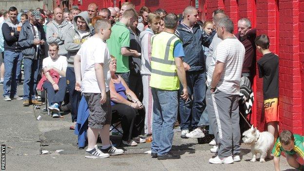 Fans queue for tickets outside Cliftonville's ground in north Belfast