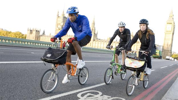 People riding on Brompton bikes
