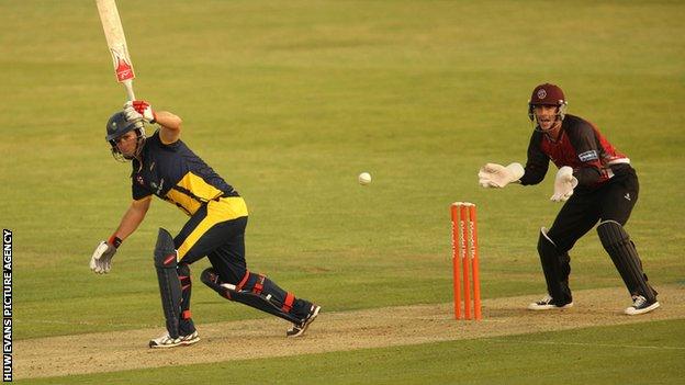 Jim Allenby plays an unorthodox one-handed shot during Glamorgan's win over Somerset