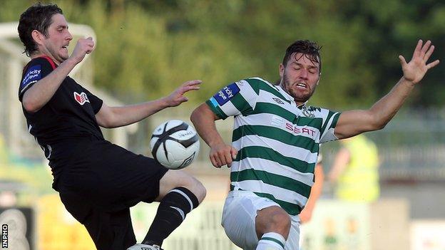 Ruaidhri Higgins battles with James Chambers in Tallaght