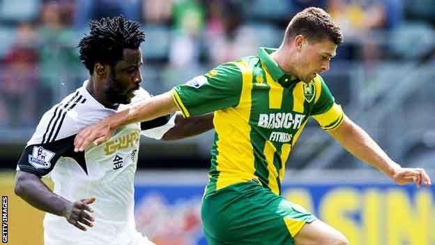 Wilfried Bony (left) makes his Swansea City debut