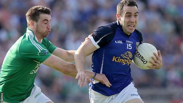 Fermanagh's Brian Cox tackles Cavan forward Eugene Keating