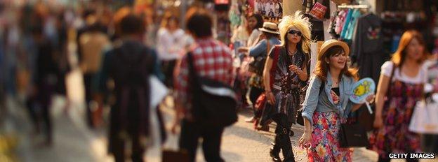 People walking along a shopping street in Japan