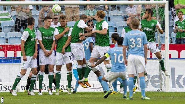 Jiloan Hamad curls the ball over the wall and past Hibernian keeper Ben Williams to give the home side the lead