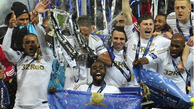 Swansea players celebrate their Capital One Cup victory