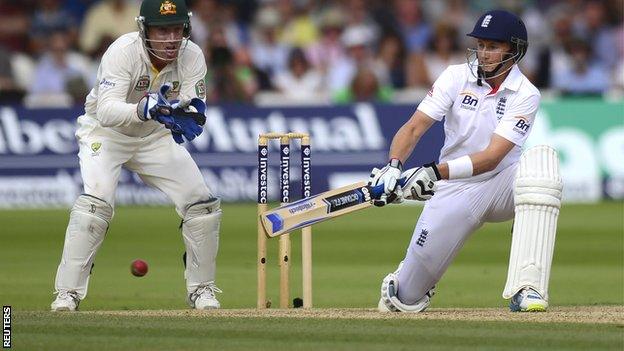 Joe Root reverse sweeps as Brad Haddin looks on