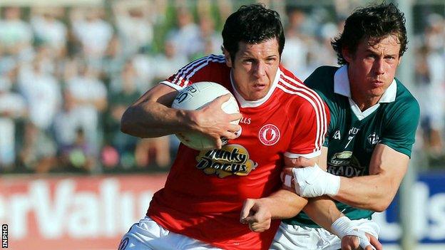 Emmet Bolton challenges Sean Cavanagh at Newbridge