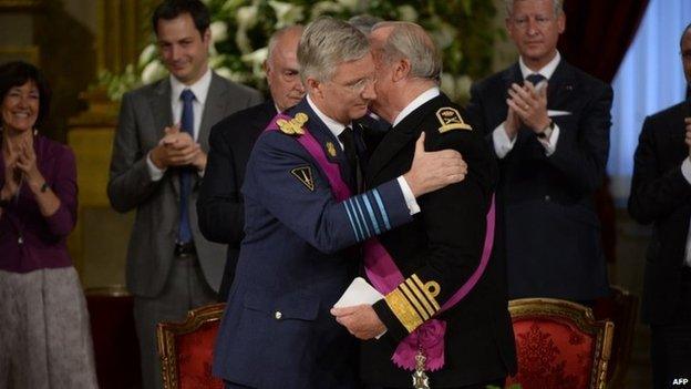 Prince Philippe hugs Albert II before the king signs the abdication treaty (21 July 2013)