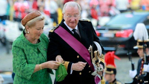 Albert II arrives with Queen Paola before a mass celebrating his 20 years as king, before he abdicates