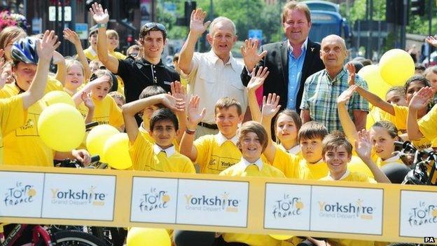 Yorkshire professional cyclist Dean Downing, Councillor Keith Wakefield, Welcome to Yorkshire chief Gary Verity and former cyclist Brian Robinson gather with local school children on the start line on the Headrow in Leeds marking one year to go until the start of the Tour De France 2014