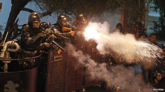 Riot police fire rubber bullets at demonstrators in Rio