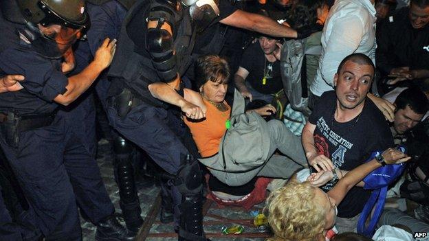 Riot police clash with protesters outside parliament in Sofia on 23 July 2013