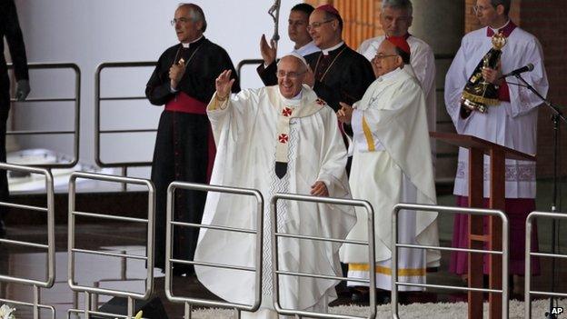 The Pope waves to crowds outside the Shrine of Our Lady of Aparecida