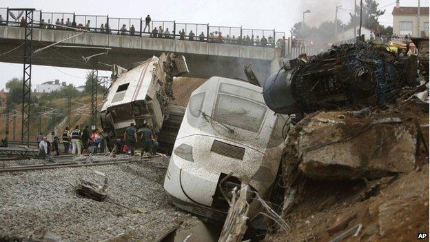Overturned carriages of derailed train near Santiago de Compostela, Spain, on 24 July 2013