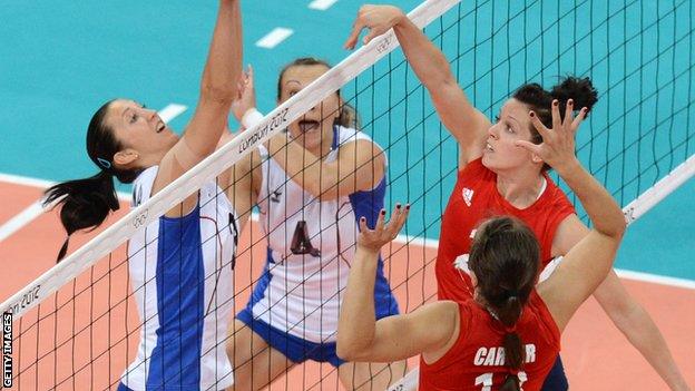 Lucy Wicks (in red) strikes at the net for Team GB in the 2012 Olympics