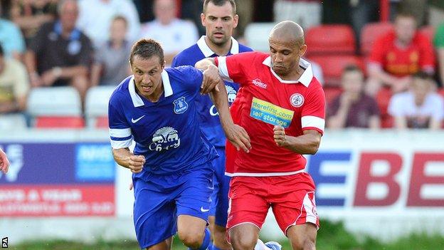 Danny Webber (right) jostles with Everton's Phil Jagielka in a recent friendly