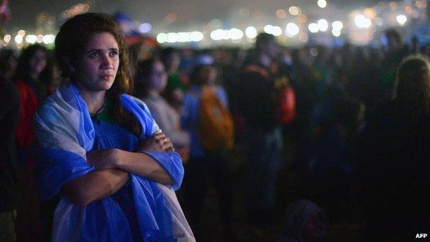 Young woman watches the Stations of the Cross, Rio (26 July)