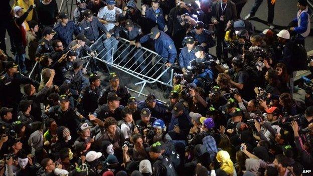 Demonstrators in Rio de Janeiro clash with police after the Pope's appearance for World Youth Day (26 July)