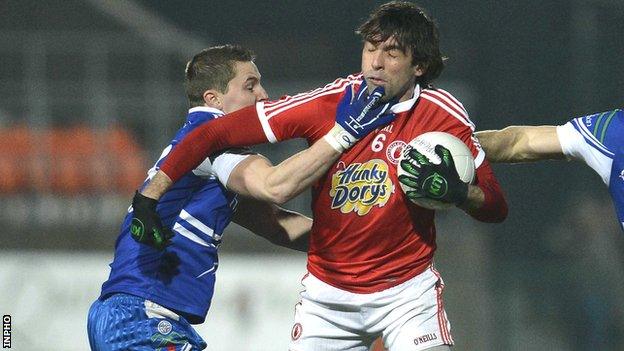 Monaghan's Shane McQuillan tackles Justin McMahon of Tyrone