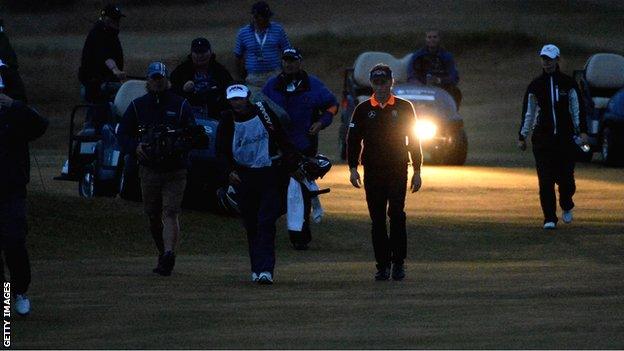 Bernhard Langer and Mark Wiebe walk down the fairway on the second hole of their play-off