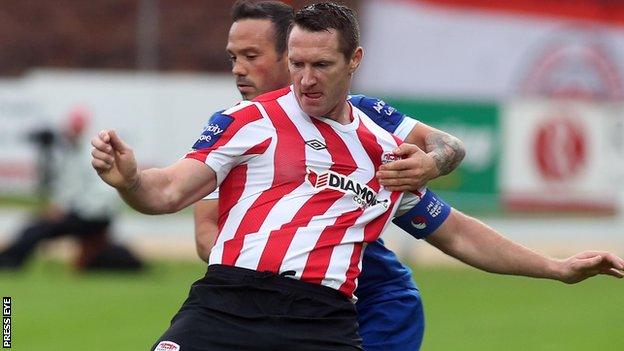 Derry's Barry Molloy is challenged by Rafael Cretaro