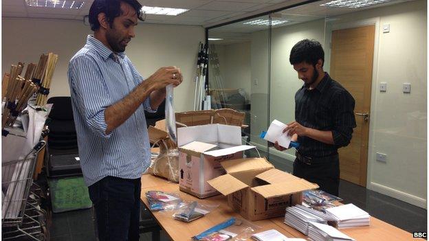 charity volunteers making up Eid packs