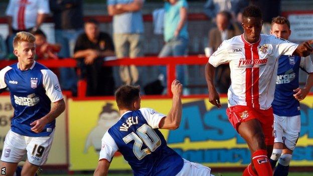 Ipswich Town's Ferdderic Veseli (centre) and Stevenage's Oumare Tounkara