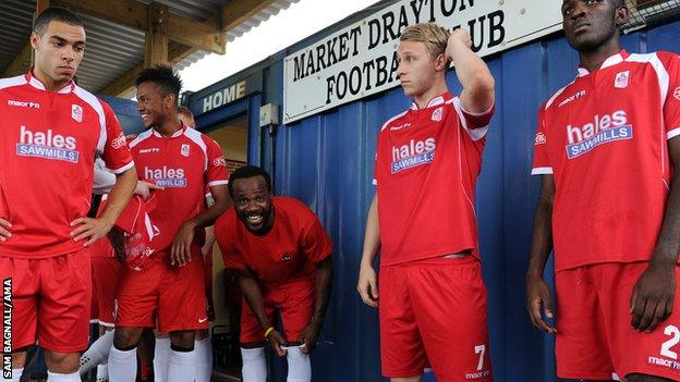 Former France defender Pascal Chimbonda [third right] makes an appearance for Market Drayton