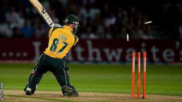 Graeme White of Nottinghamshire is bowled by Shaun Tait of Essex