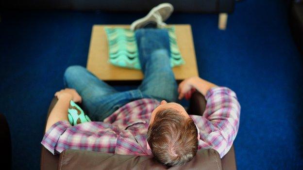 Man relaxing on sofa
